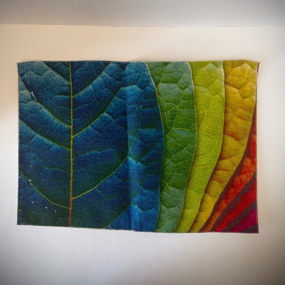 Placemats, 8 vibrant cloth with multi coloured leaf pattern. NEW!